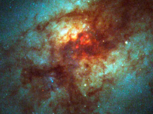 a messy galaxy shown in red and blue