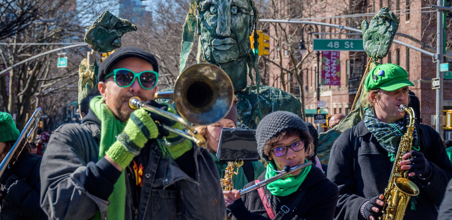 a trombone player, a flute player and a saxophone player in a parade