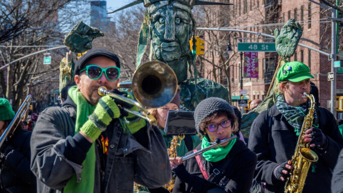 a trombone player, a flute player and a saxophone player in a parade