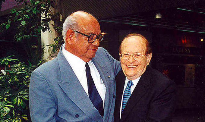 Luis Miramontes stands with George Rosenkranz