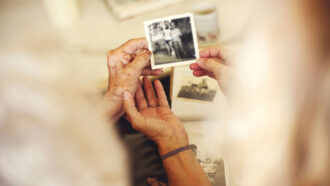 Women looking at an old photograph