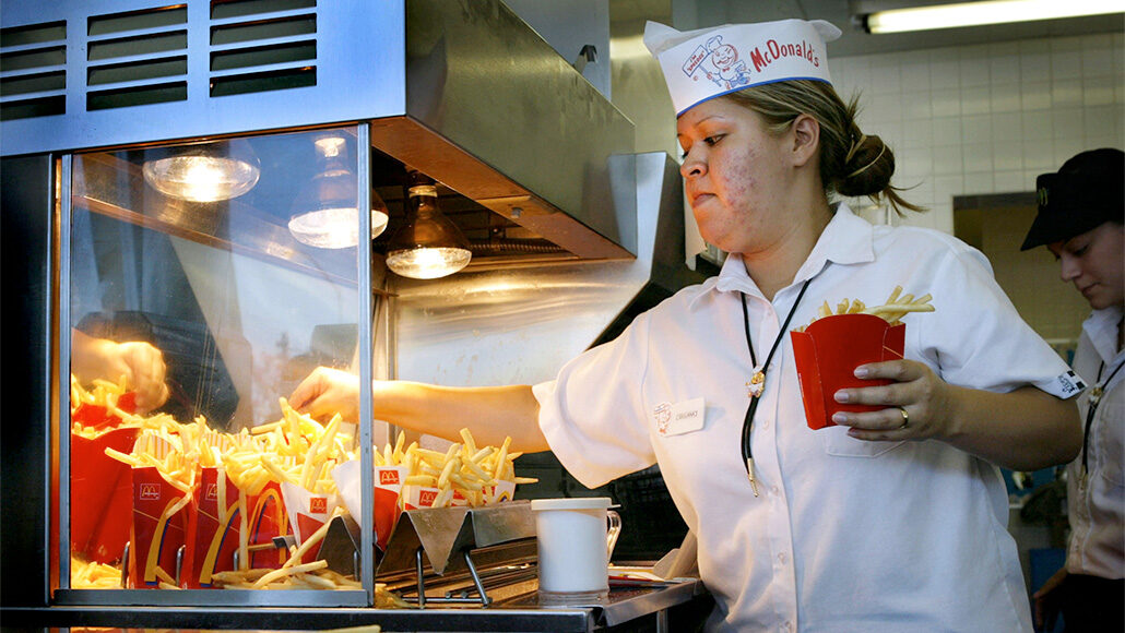 a young woman working at a McDonald's restaurant