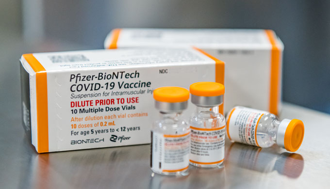 boxes and vials of the Pfizer covid vaccine