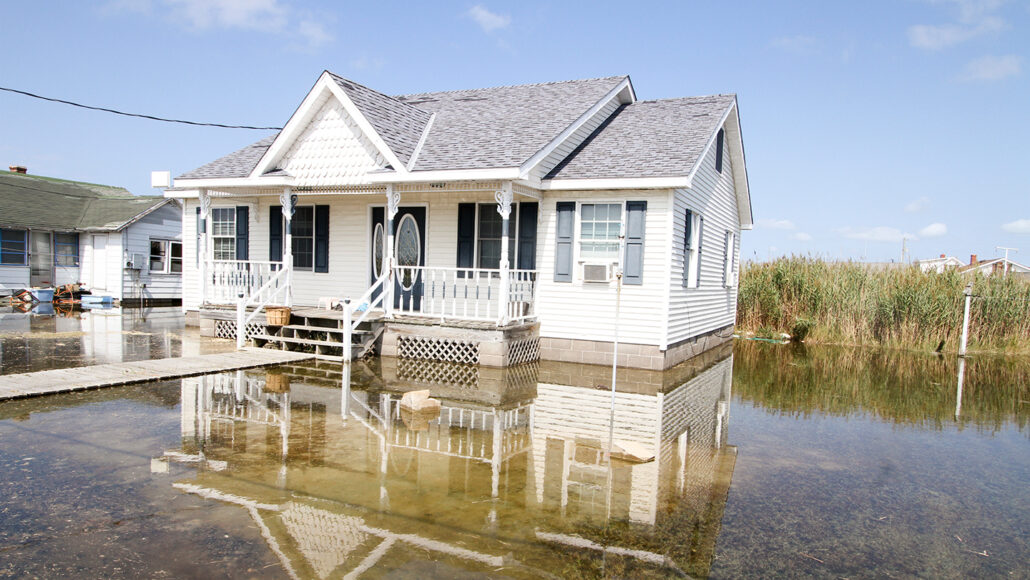 house on Virginia's Tangier Island surrounded by flood water