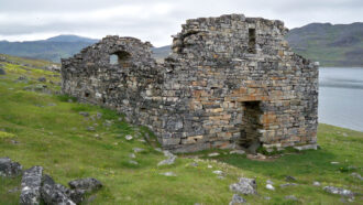 image of the remains of a church on a hillside in Greenland