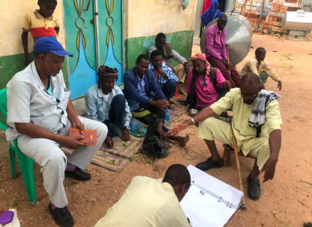 photo of a group of people in a village in Somalia