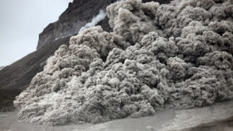 A pyroclastic flow, or an avalanche of gas, ash and rock, flowing down a volcano