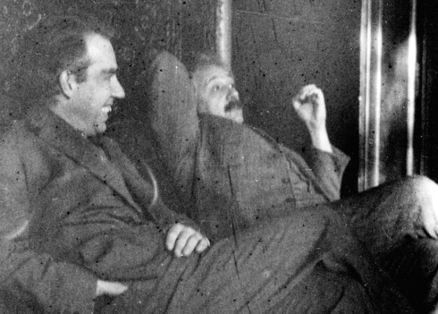 black and white image of Neils Bohr and Albert Einstein seated