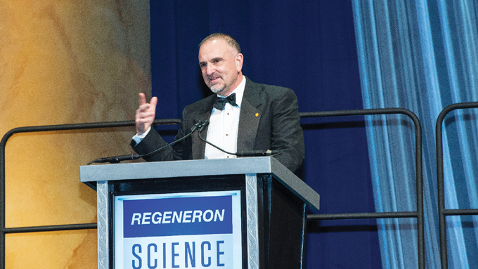 image of George Yancopoulos speaking at a podium