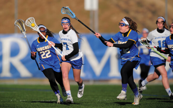 image of players from the Marymount University women's lacrosse team in a game against Goucher College