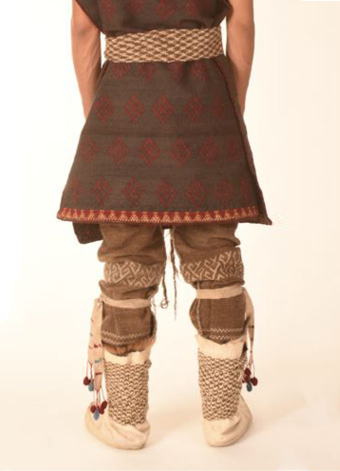 photo of a model wearing a woven reproduction of Turfan Man’s outfit