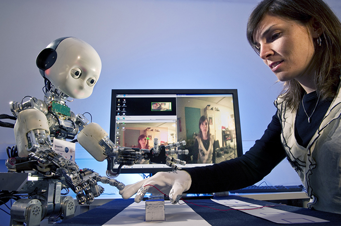 image of a woman working with the iCub robot