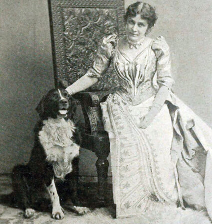 black and white image of Eunice Newton Foote seated and petting a dog