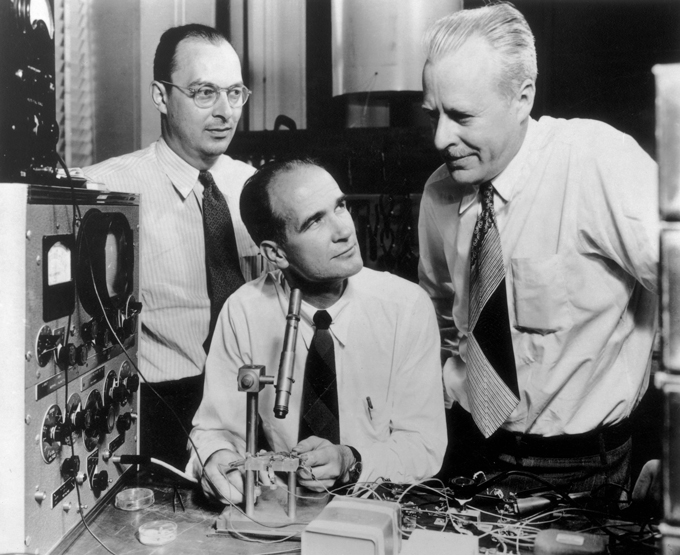 historical photo of John Bardeen, William Shockley and Walter Brattain working with technical equipment