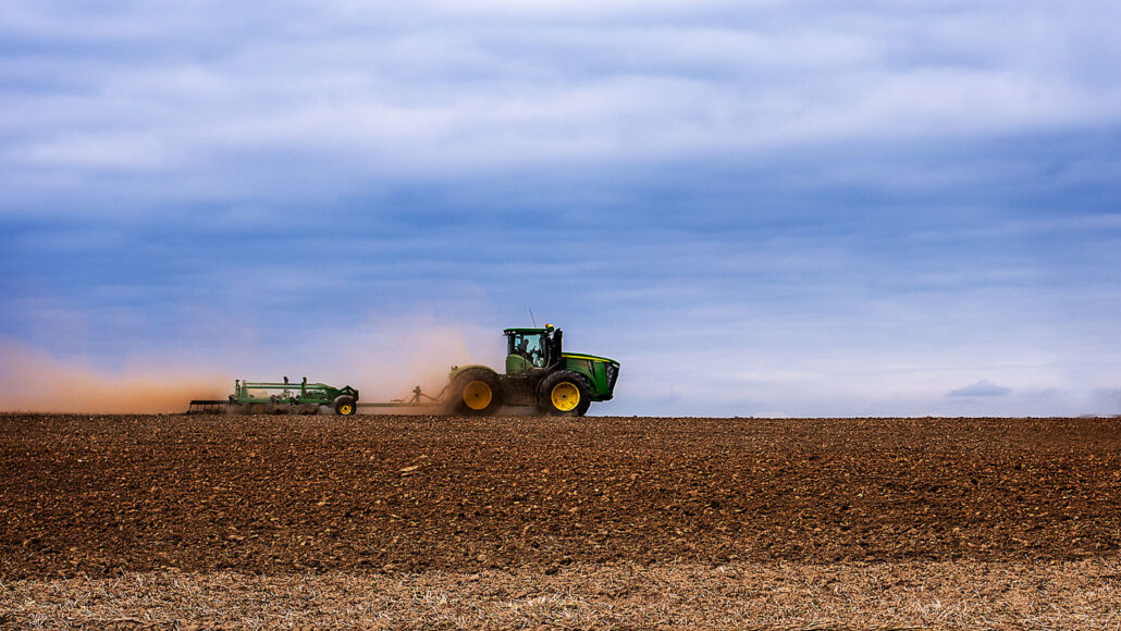 photo of a tractor tilling a field