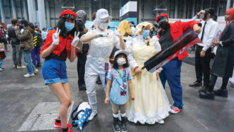 attendees dress up in costumes at Anime NYC