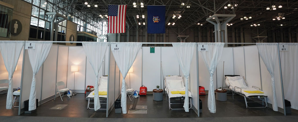 a row of hospital cots at the Javits Center