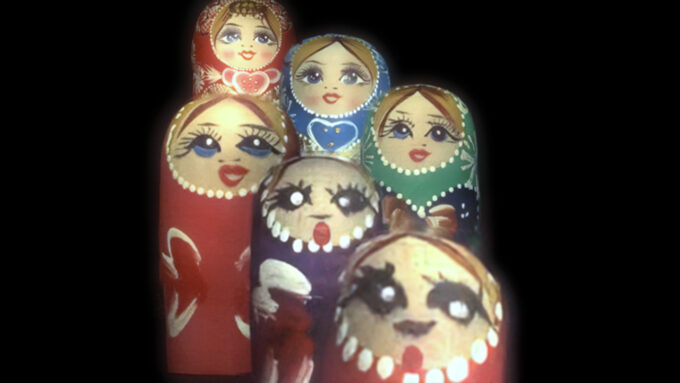 six nesting dolls at different distances, all in focus