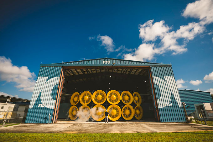 yellow fans in a warehouse form the Wall of Wind
