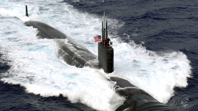 the USS Asheville nuclear submarine, partially above the surface of the ocean