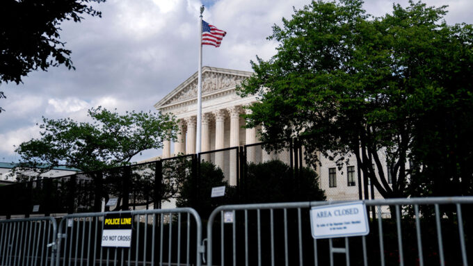 photo of two sets of fences in front of the Supreme Court building