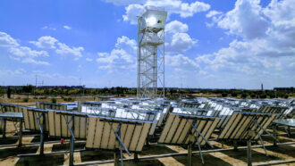 array of reflectors around a tower with a solar reactor