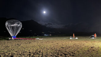 photo of an inflated balloon in a field before launch in the Seychelles