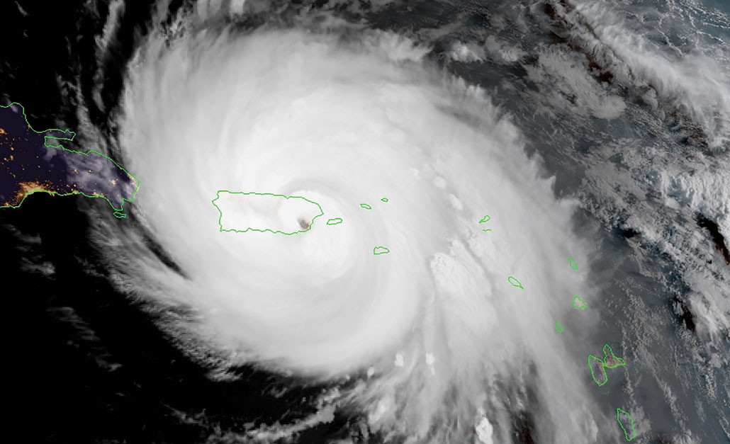 satellite image of the Hurricane Maria with its eye directly over Puerto Rico, outlined in green