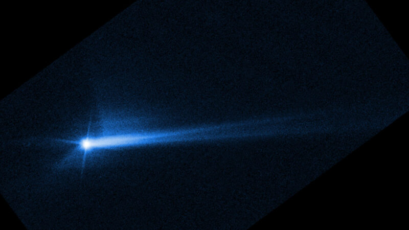 A blue split stream of dust and rock wafting off the asteroid Dimorphos seen after the DART spacecraft mission