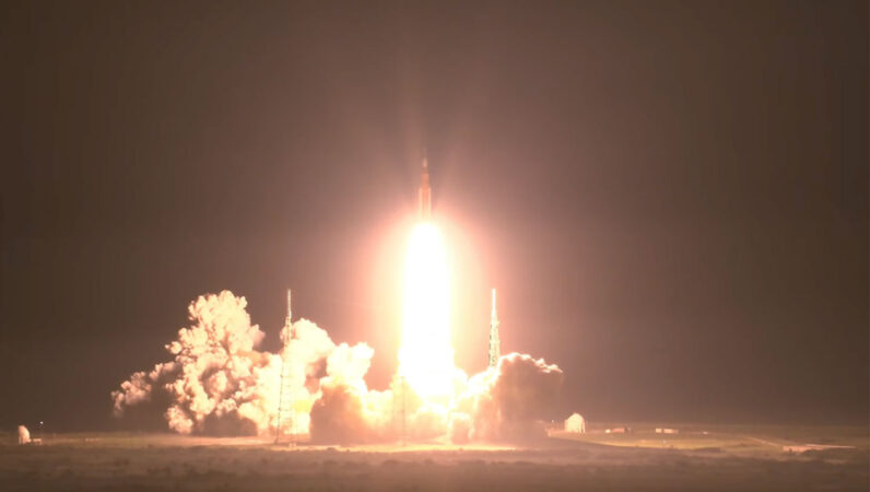A photo of the night launch of the Space Launch System rocket