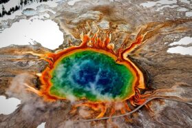A photo from a high angle of the Grand Prismatic Hot Spring