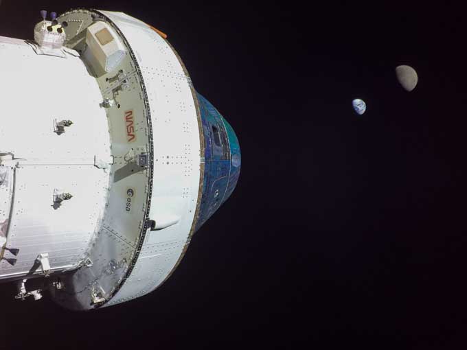 the Orion space capsule against the backdrop of space, with Earth and the moon as tiny semicircles in the distance