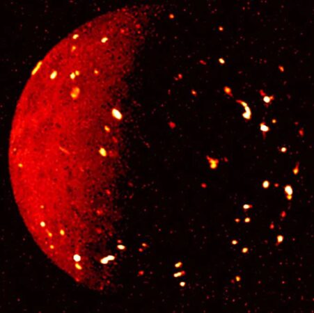 An infrared image of Io with hot spots speckling the surface.