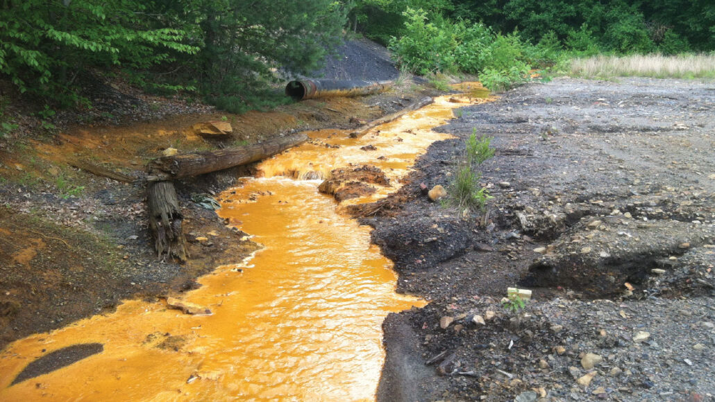 orange water flows from a mine drain in in Pennsylvania