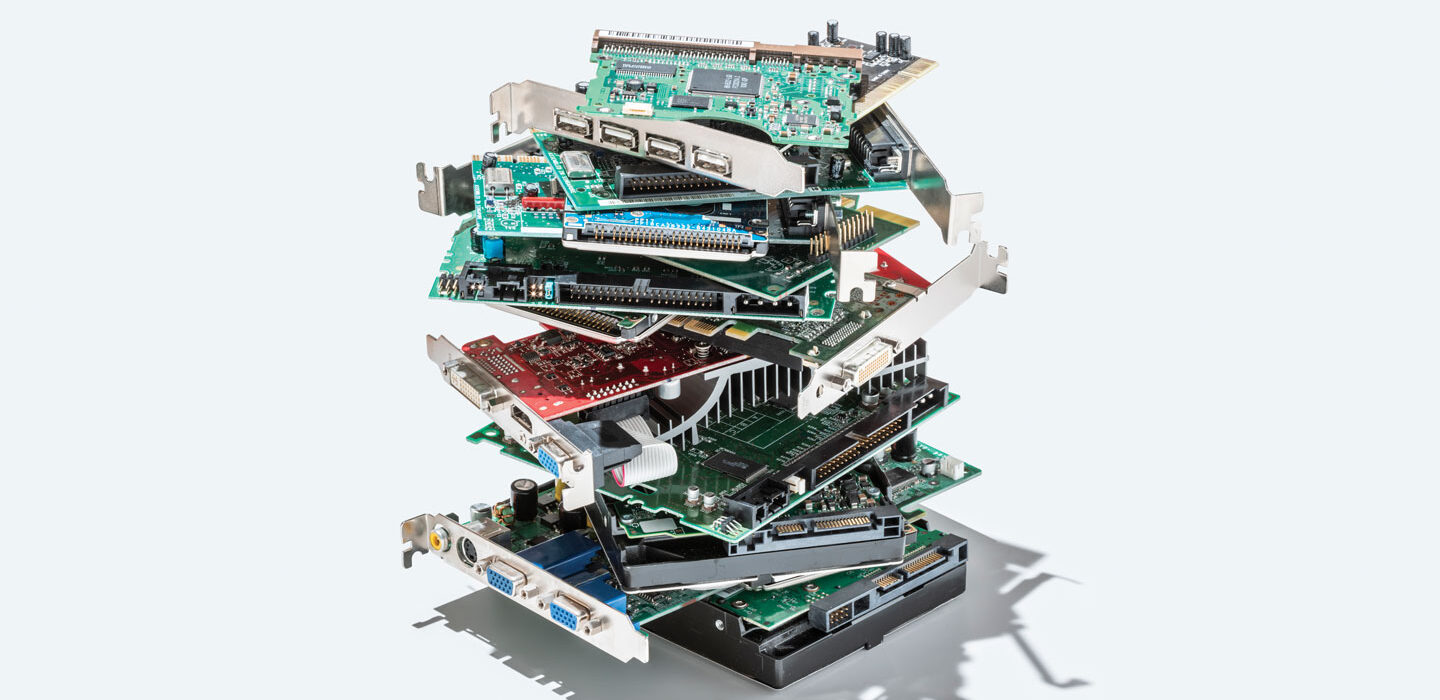 a pile of hard disk drives on a white background