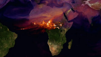 An opaque photo of a wildfire overtop an opaque satellite image of Africa.
