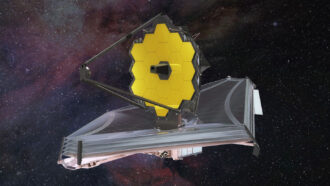 An illustration of the James Webb Space Telescope deployed in space.