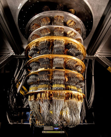 A dilution refrigerator, a device made of metal rings with many thin wires attached to a quantum processor at the bottom