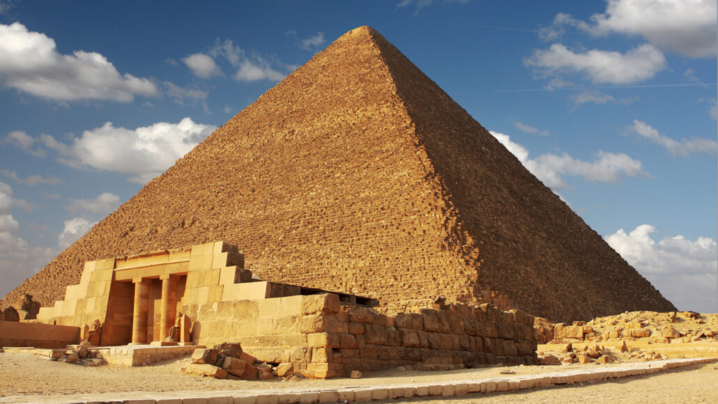 The Great Pyramid of Giza against partly cloudy skies