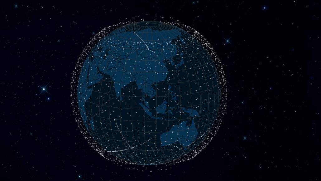 A view of the Earth from space with several white dots, representing Starlink satellites, forming a ring around it.
