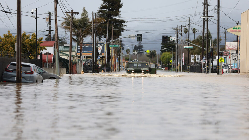 A flooded street with stormy skies overhead