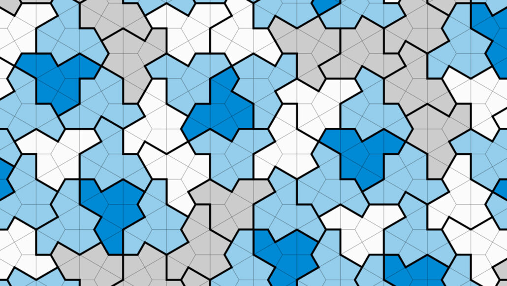 An image of several dark blue, gray, white, and light blue, 13-sided tiles interconnected.