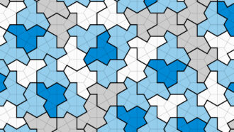 An image of several dark blue, gray, white, and light blue, 13-sided tiles interconnected.