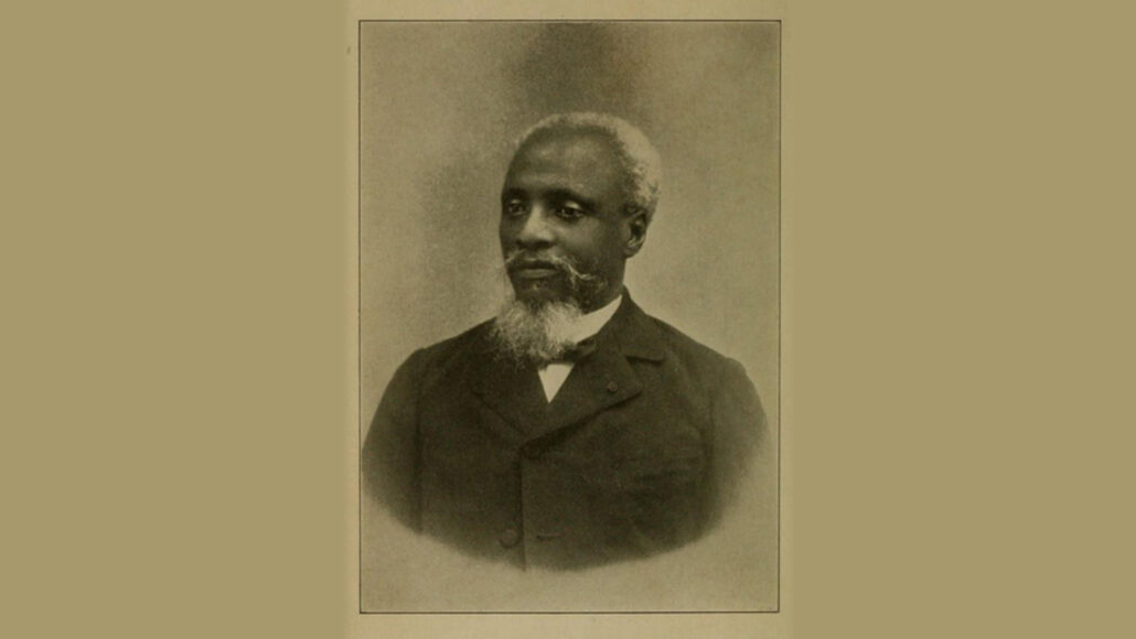 A photo of Anténor Firmin in black and white overlayed on a tan background.