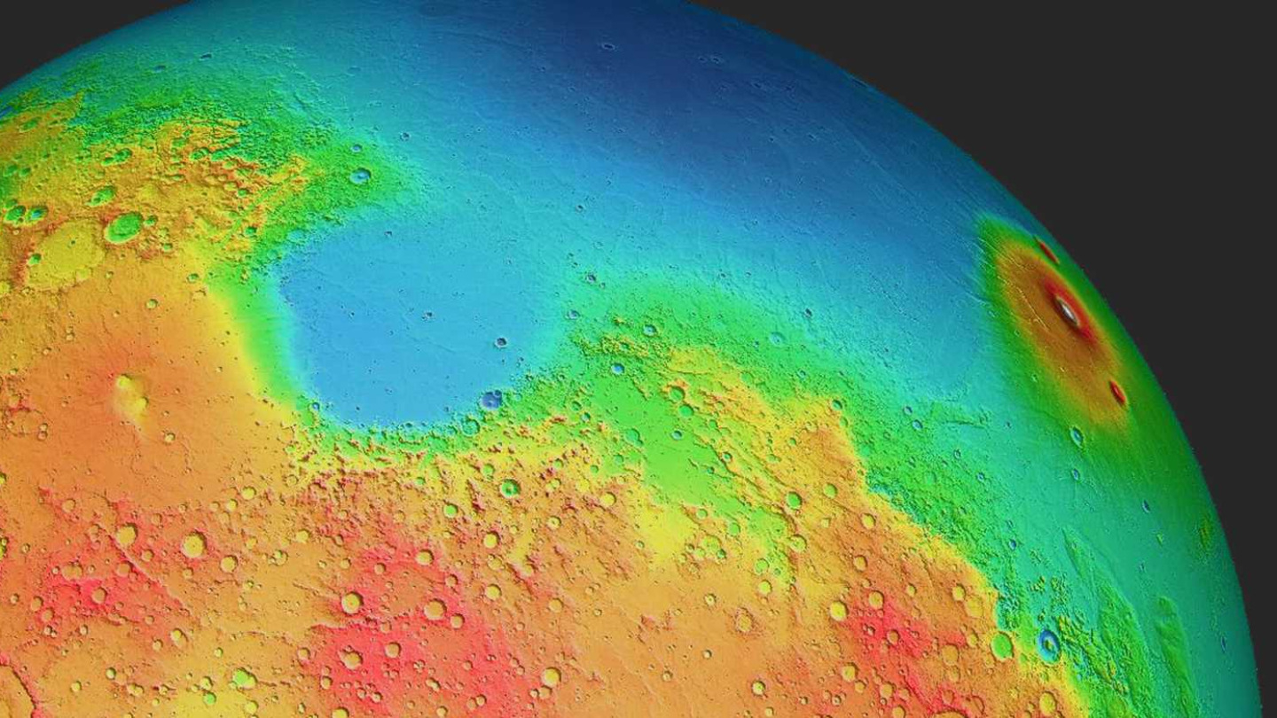 The northern hemisphere of Mars (shown in false color) is mostly lowlands (blue), while the southern hemisphere is higher and more mountainous. This e