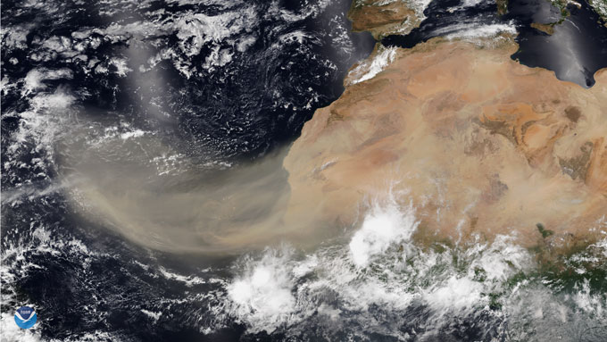 A satellite image of northwest Africa in 2020 showing a large plume of dust from the Sahara Desert traveling over the ocean
