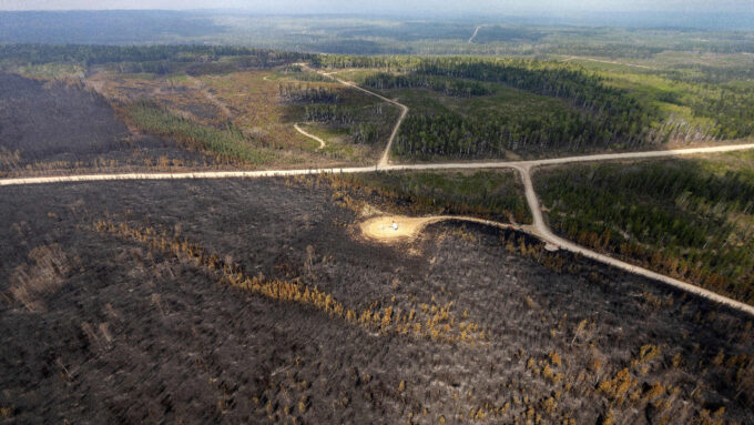 A drone photo of a southern stretch of the North American boreal forest burnt by wildfires.