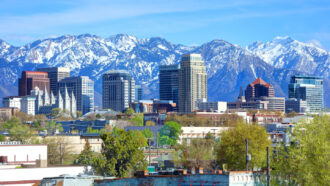 photo of the Salt Lake City downtown skyline with the Wasatch Mountains in the background