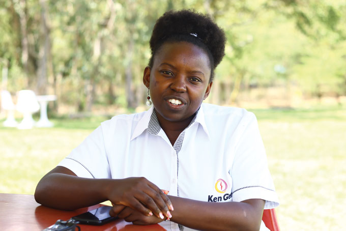 photo of Anna Mwangi sitting at a table