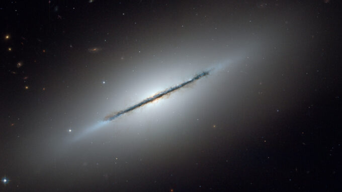 A photo of lenticular galaxy Messier 102, also known as the Spindle Galaxy.